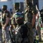 Pasukan Hamas. (Photo by Mahmud hams / AFP)