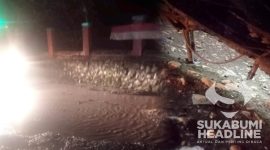 Lobang jalan digenangi air di Jampang Tengah. l Yopi Latul