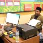 Ketua MUI Kecamatan Bojonggenteng, Ustadz Dadan Hamdani saat membuat laporan polisi. l Hasal Algofiki