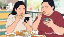 Ilustrasi mindless eating, makan sambil memainkan handphone mengakibatkan berat badan naik - sukabumiheadline.com