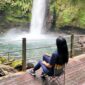 Titi Kamal duduk sambil memandang Curug Sawer, Situ Gunung - @titi_kamall